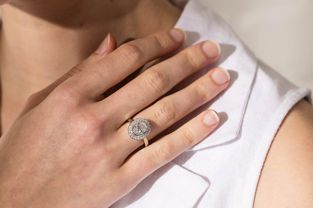 Model wearing diamond ring featuring fluorescent diamond