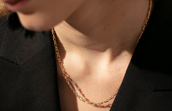 Model wearing a yellow gold chain