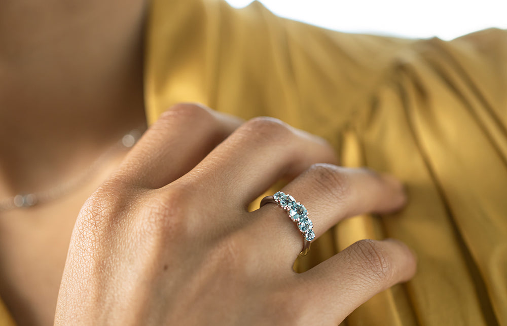 Model wearing five stone Octavia Aquamarine Ring