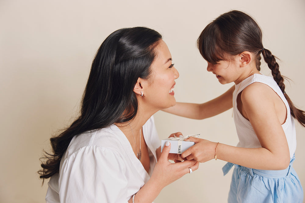 Daughter giving Mum a gift