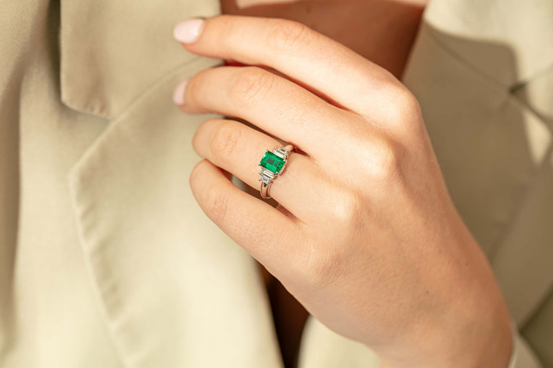 Model wearing Platinum emerald and diamond ring