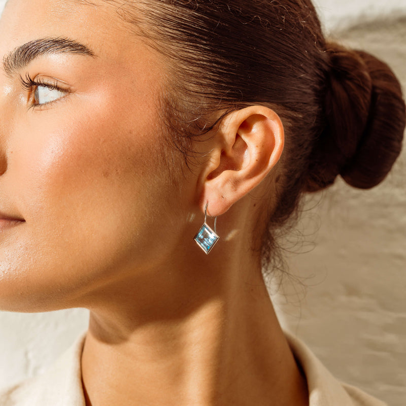 Deja Vu 18ct White Gold Blue Topaz Drop Earrings - Earrings - Walker & Hall