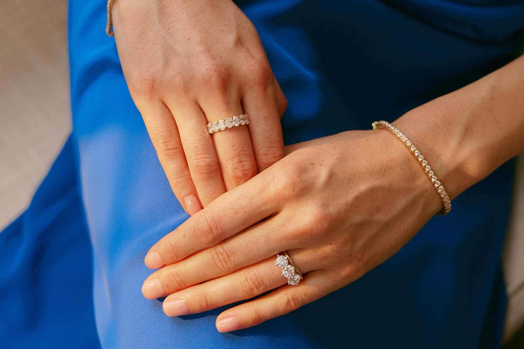 Model wearing diamond Coronado ring, diamond Panorama ring and diamond Jubilee bracelet