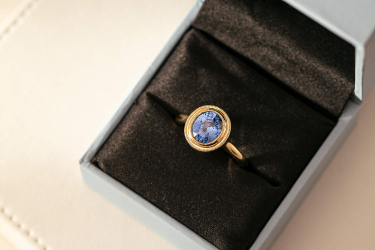 Custom designed tanzanite ring in Walker & Hall ring box