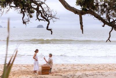 Man proposing to his partner on a beach