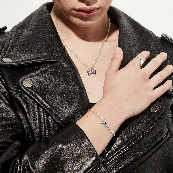 Model wearing SGC x W&H exclusive collaboration bracelet, ring and necklace