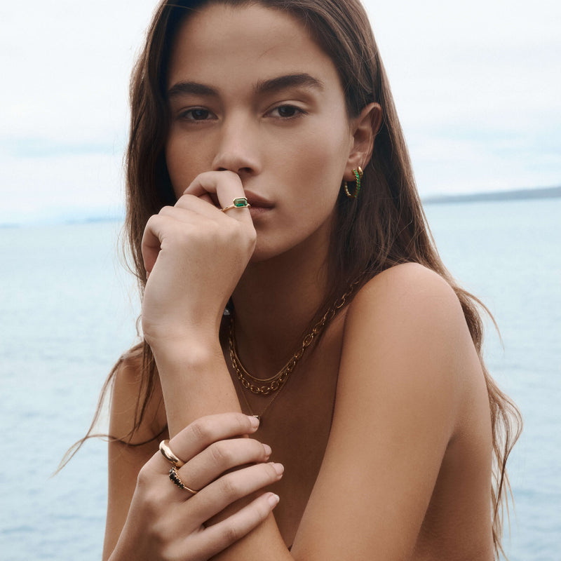 Model wearing Natural Gemstone and Gold Jewellery