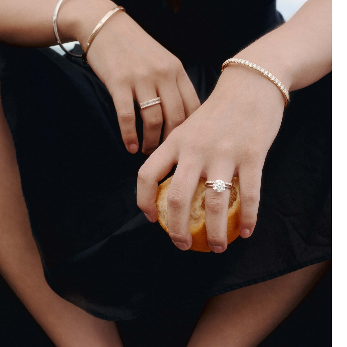 Model wearing diamond 1899 rings and bracelets