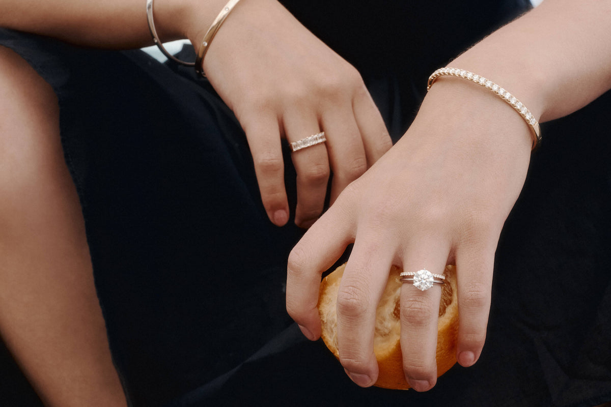 Model wearing 1899 diamond rings and bracelets