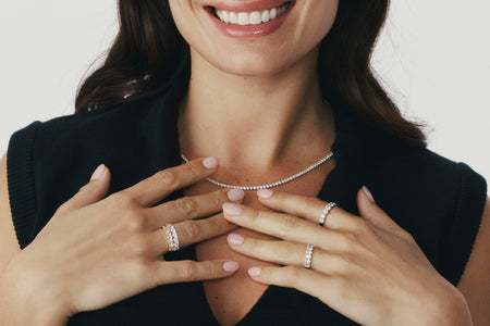 Model wearing natural diamond rings