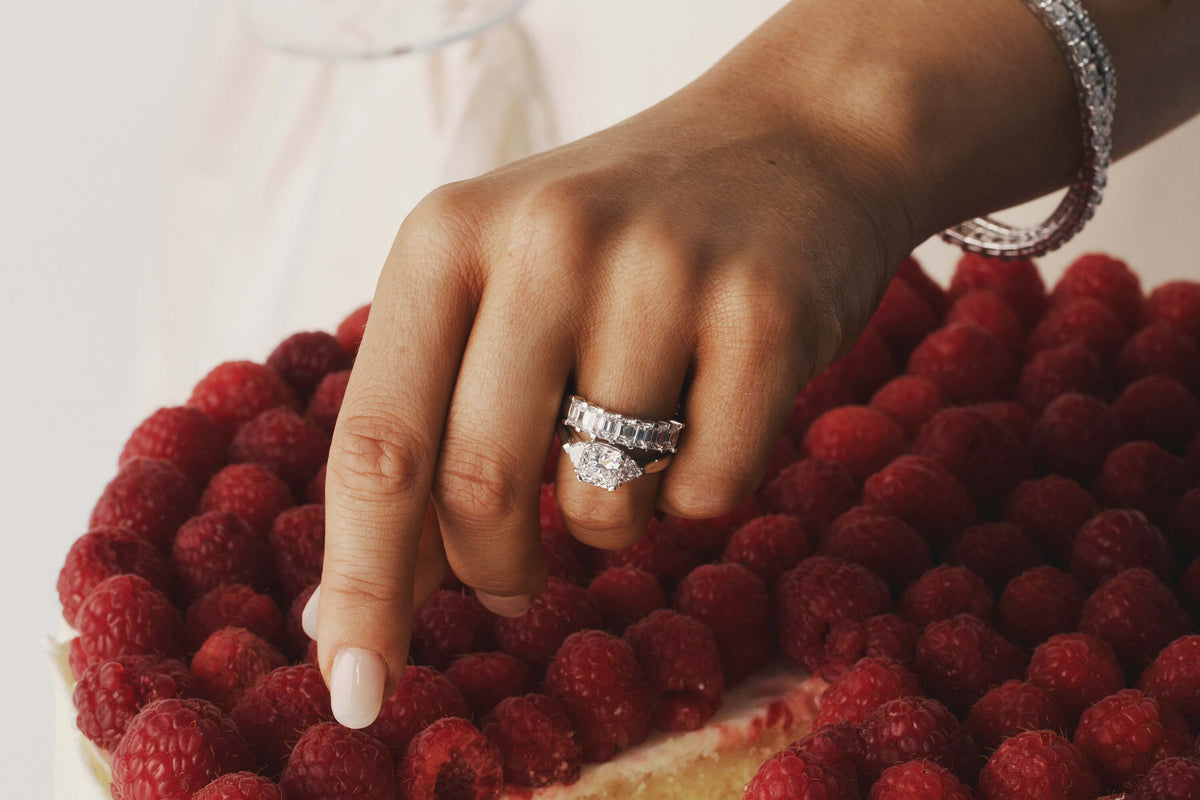 Close up of model wearing radiant cut diamond ring