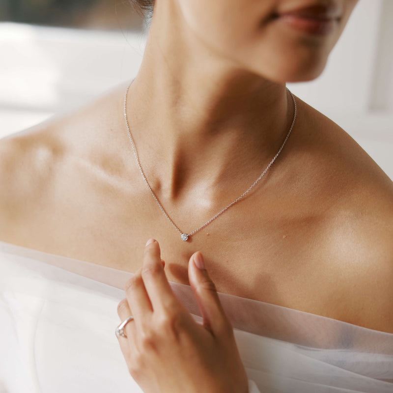 Bride wearing Natural Diamond Natalia Pendant and Natalia Ring