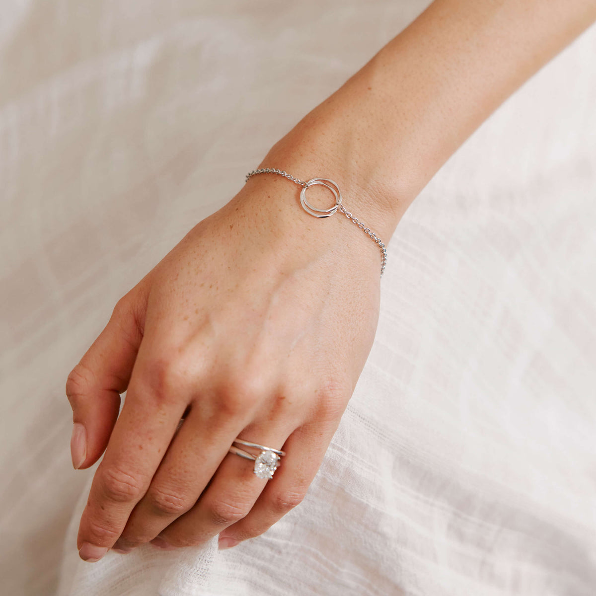 Model wearing sterling silver Entwined Bracelet