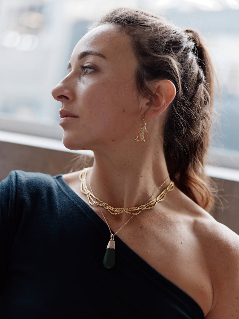 Model wearing Vintage necklaces and earrings