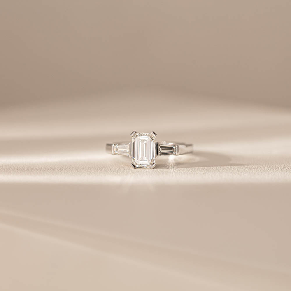 18ct White Gold Emerald Cut Diamond Three Stone Ring - Walker & Hall